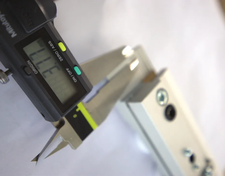 Digital caliper measuring a sliding bracket