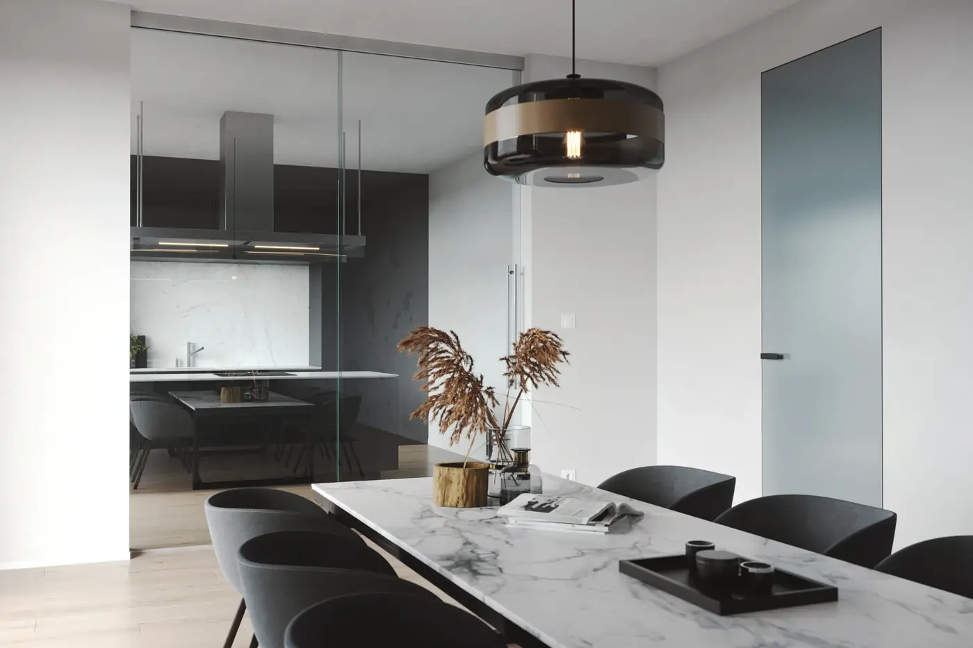 Kitchen separated from the dining area by a Frontal sliding glass wall