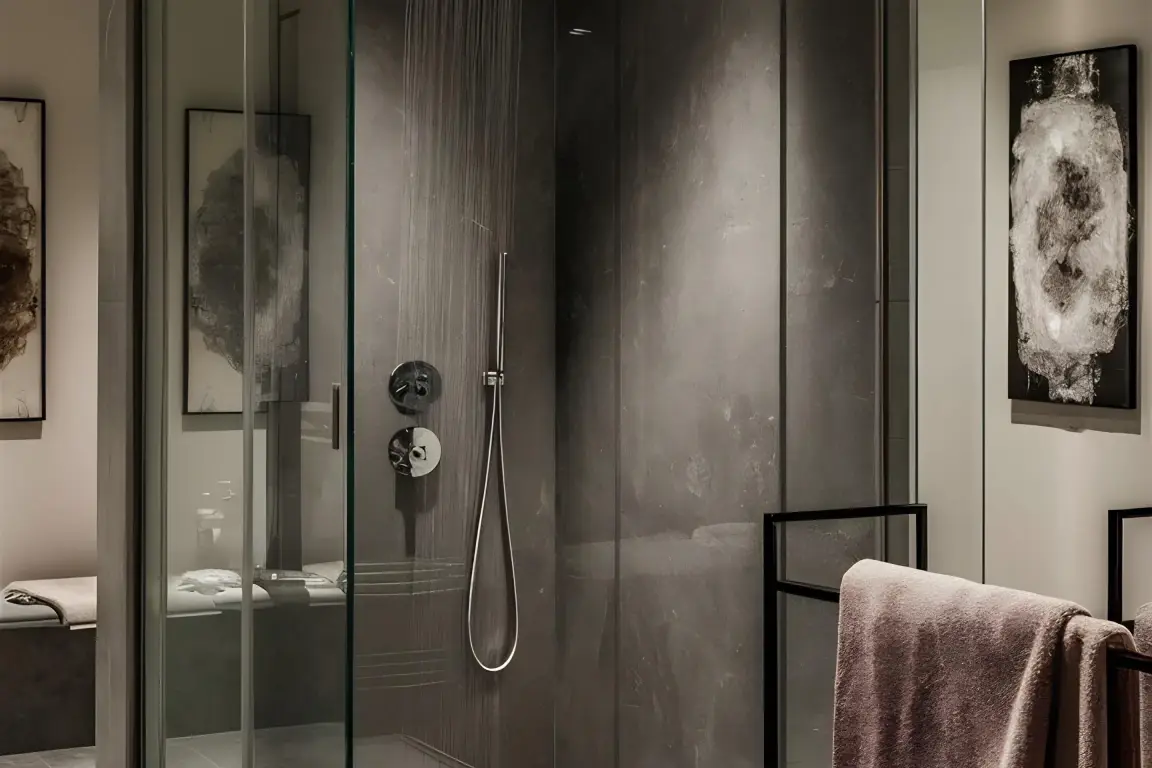 Shower enclosure in a stone-clad bathroom