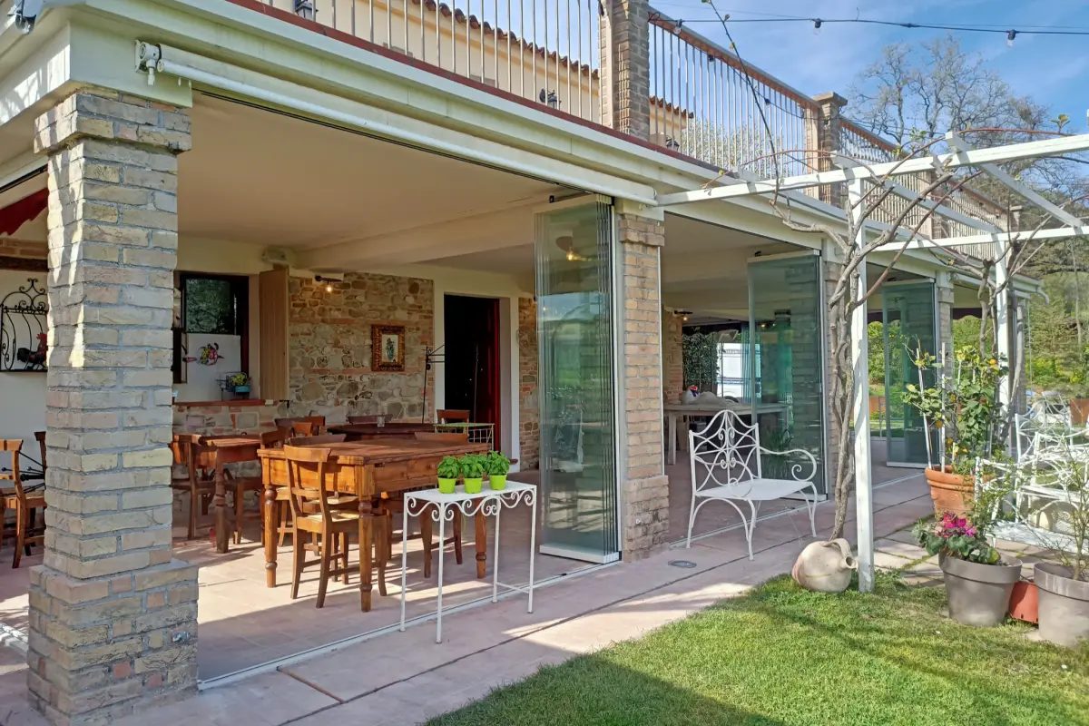 Porch with a laid table enclosed by Starglass glazing