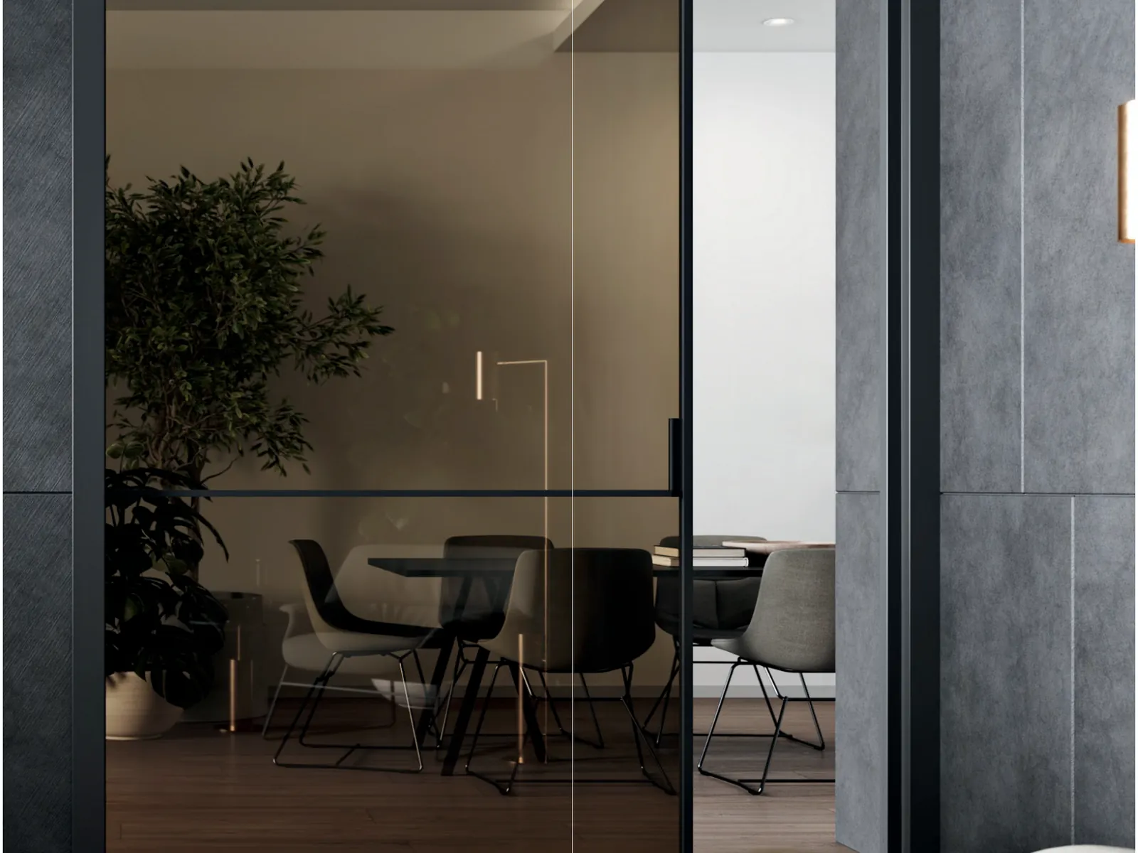 Ante Fusion con telaio scuro fra un ingresso e la sala da pranzo