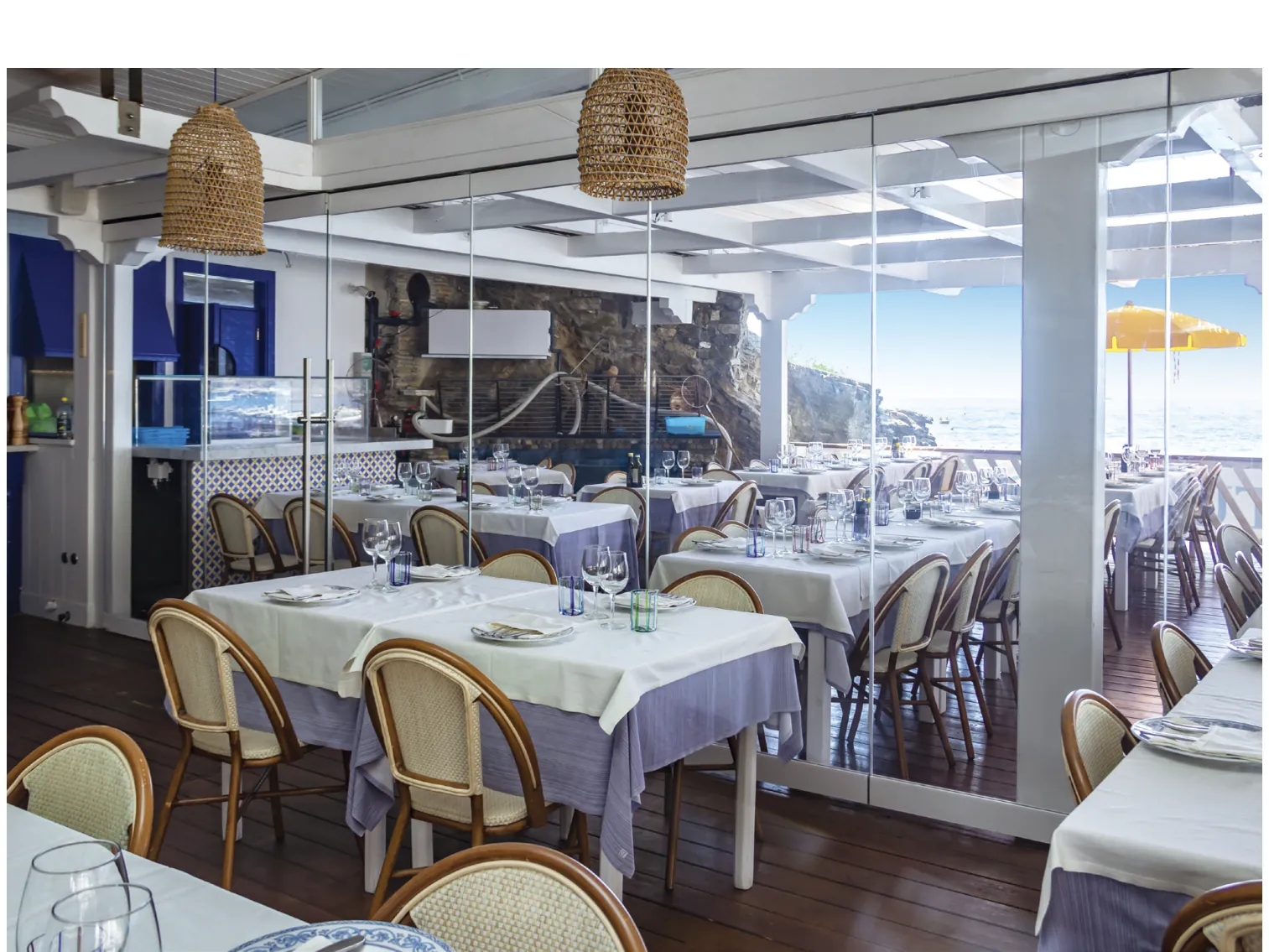 Restaurant dining room enclosed with Parking, with the view beyond the glass